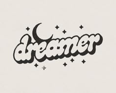 the word dream written in cursive writing with stars and crescents on white paper