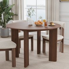 a dining table with two chairs around it