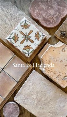 several different types of tile sitting on top of a wooden table