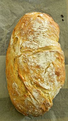 a loaf of bread sitting on top of a piece of paper