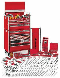 a red tool cabinet with tools in it