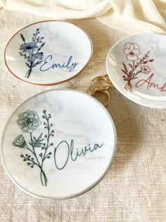 three personalized plates with flowers on them