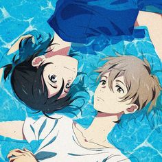 two people floating in a swimming pool with one holding the other's head above water