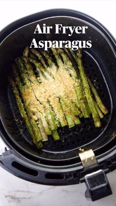 an air fryer with asparagus in it and the words, air fryer asparagus