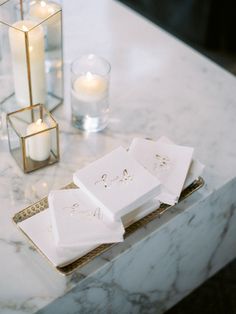 napkins and candles on a marble table