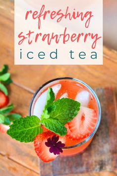 an iced tea with strawberries and mint on the side