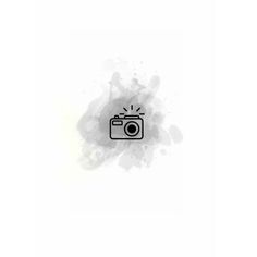 a black and white photo camera with watercolor splashes on the side, in front of a white background