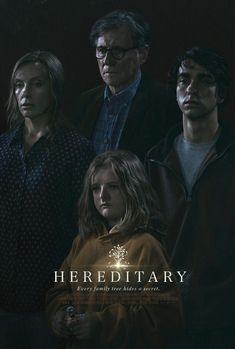 a group of people standing next to each other in front of a dark background with the words herediary on it