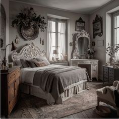 a bedroom with antique furniture and mirrors on the wall