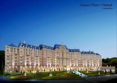 a large building with many windows and lights on it's sides at night time