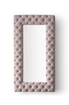 a square shaped mirror with an upholstered frame and buttoned buttons on the front