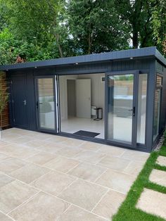 a modern garden room with sliding glass doors