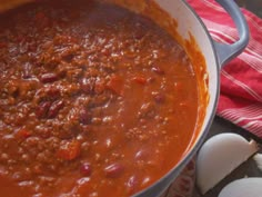 a pot full of chili and garlic on a table