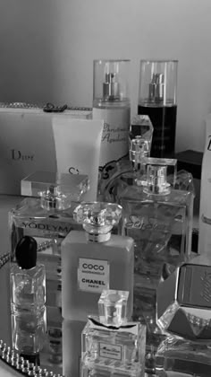 several bottles of perfume sitting on top of a table