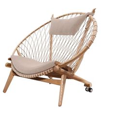 a chair with wheels and a cushion on the back is made out of natural wood