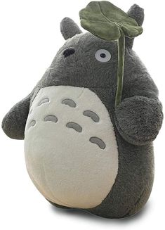 a stuffed animal with a leaf on it's head