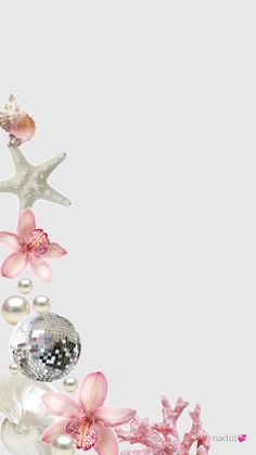 pink flowers and pearls are arranged in the shape of a starfish on a white background