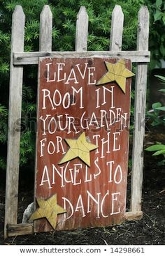 a wooden sign that says leave room in your garden for the angels to dance