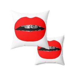 two pillows with red lips on them, one is black and the other is white