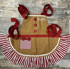 a brown apron with red and white stripes on it