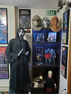 a display case filled with halloween decorations and masks