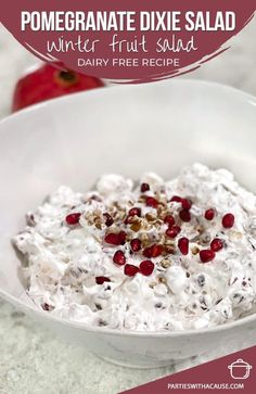 a white bowl filled with fruit salad on top of a table