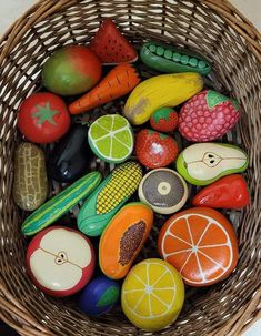 a wicker basket filled with lots of different types of fruit and veggies