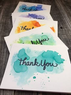 watercolor thank you cards with the words thank you written in cursive ink