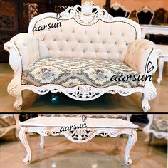 an old fashioned white couch and table in a room