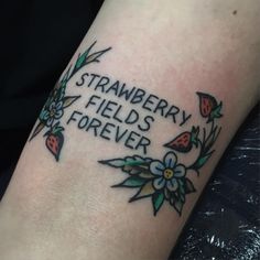 a tattoo that reads strawberry fields forever