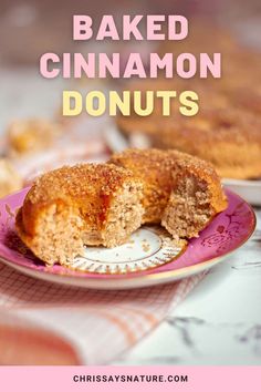 baked cinnamon donuts on a pink plate with the words, baked cinnamon donuts