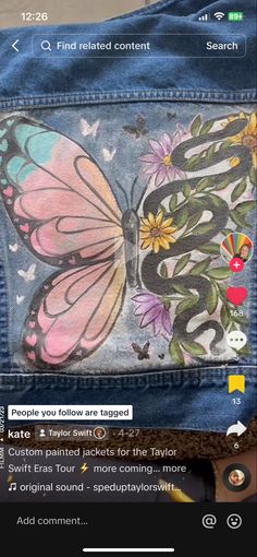 the back pocket of a jean jacket with a butterfly painted on it