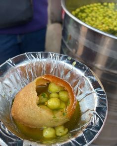 some food is sitting in a metal bowl