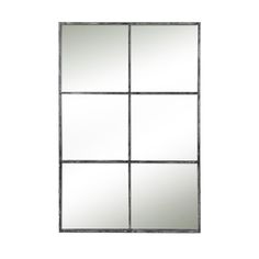 a mirror that is on the wall in front of a white background with four squares