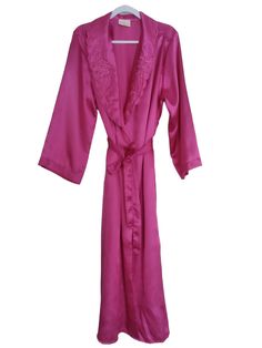 This vintage hot pink long satin robe from Liboria Creations is perfect for those special occasions. It elegantly drapes around your body, made with luxurious high quality satin fabric and is available in size large. Its classic design is an ideal fit for any woman and makes an excellent gift to show kindness and appreciation to your loved one. Stylishly structured, the robe has classic elements with a unique pink hue that will make you stand out. Get this made-in-Canada product now and experien Long Pink Silk Robe, Pink Satin Finish Robe For Wedding, Pink Satin Robe With Satin Finish, Pink Silk Wedding Robe, Elegant Long Pink Robe, Long Pink Robe For Wedding Night, Pink Satin Spring Robe, Pink Long Sleeve Satin Robe, Long Pink Robe For Wedding