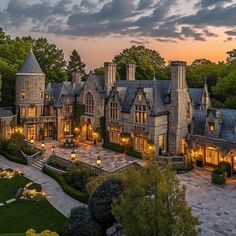 an aerial view of a mansion at dusk