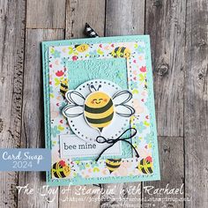 a close up of a card with a bee on it