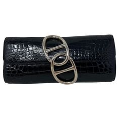 Hermes Black Niloticus Shiny Crocodile Egee Clutch. Rare clutch with silver chaine d'ancre links closure. Excellent condition. Interior clean. Great evening bag and accessory. Includes dust bag. Guaranteed authentic. Add this to your Hermes collection. Hermes Collection, Interior Clean, Shiny Silver, Fashion Handbags, Evening Bags, Dust Bag, Purses And Bags, For Sale, Silver