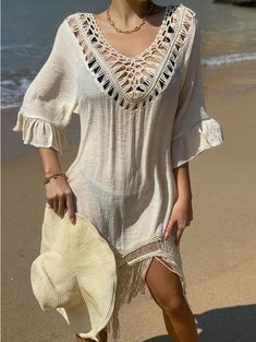 Our BOHO crochet cover up dress is perfect for this summer! Wear at the beach or wear a slip under it to make the cutest BOHO dress for a day on the town. Spring Crochet Trim Beach Cover-up Dress, Beige V-neck Beach Dress For Vacation, V-neck Beach Dress With Lace Trim, Summer Beachwear Cover-up With Lace Trim, Beige V-neck Boho Dress For Beach, Bohemian Hollow Out Dress For Beach Cover-up, Summer V-neck Hollow Out Cover-up, V-neck Beach Dress With Lace Trim As Cover-up, Spring V-neck Crochet Beach Dress