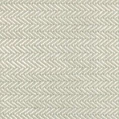 an upholstered white fabric textured with small, diamond - shaped stitchs