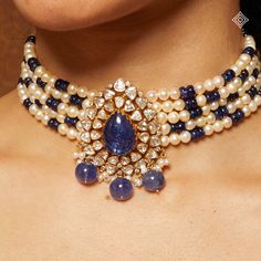 A detailed look at our mesmerizing 18K Jadau choker, adorned with captivating Tanzanite beads and delicate cultured pearls, complemented by a stunning Tanzanite and Valanda pendant.  WhatsApp 9964641869 for enquiries.  📍Visit our Flagship Showroom,near Safina Plaza now. Look for the DIAMOND logo! Jadau Choker, Tanzanite Beads, Indian Bridal Jewellery, Elegant Jewellery, Diamond Logo, Uncut Diamond, Indian Jewellery, Jewelry Patterns, Elegant Jewelry