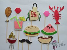 a bunch of food on sticks with some decorations