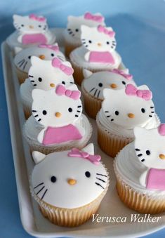 hello kitty cupcakes are arranged on a tray