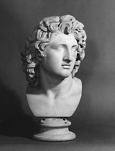 a bust of a woman with curly hair