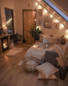 a bedroom with wooden floors and lights on the wall above it is decorated in neutral colors