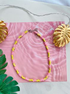 This necklace is waterproof so it's perfect for summer! It is 14 inches long and has a 2-inch extender chain so it can be adjusted to be 14-16 inches long! Pink Summer Choker Jewelry, Pink Necklaces, Diy Jewelry Unique, Pink Necklace, Waterproof Jewelry, Seed Bead Necklace, Pink Lemonade, Seed Bead Jewelry, Jewelry Unique