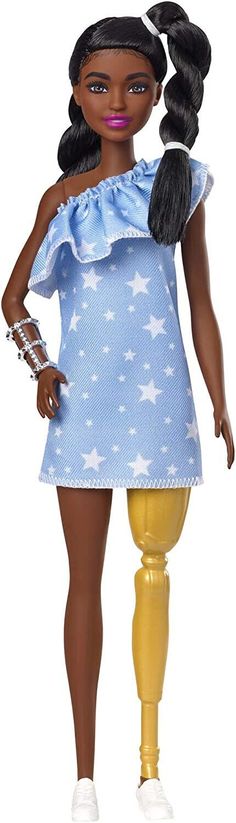 the doll is wearing a blue dress with stars on it