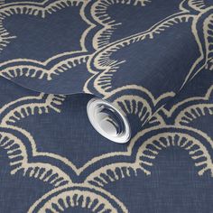 a blue and white wallpaper with an intricate design on the back side of it