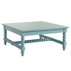 a small coffee table with two legs and a square top, in light blue color