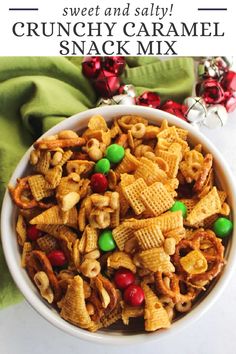 a white bowl filled with christmas snack mix